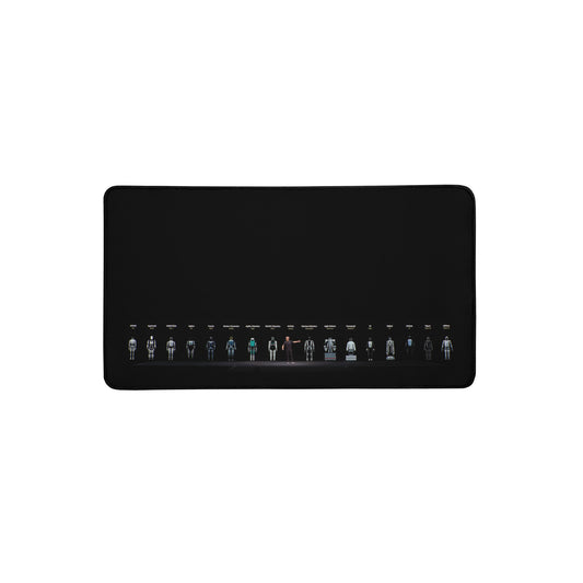 Product mockup photo of the Jensen and the Robots Desk Mat 12″×22″.