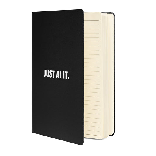 Product mockup photo of the JUST AI IT. Hardcover Bound Notebook.